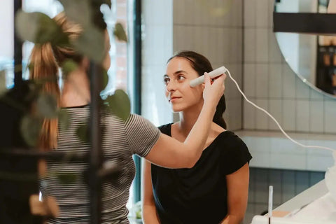 Customer receiving professional skin analysis in Brewing Beauty’s dedicated space